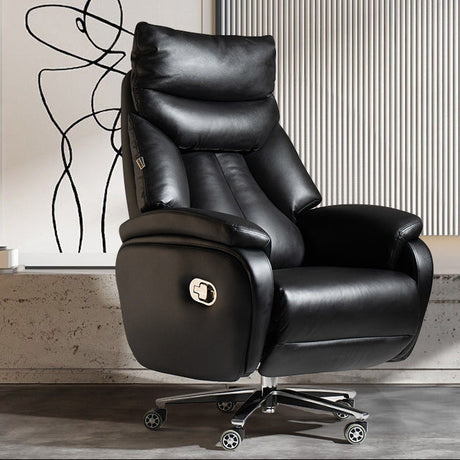 Black leather recliner chair in a modern room with abstract art on the wall.